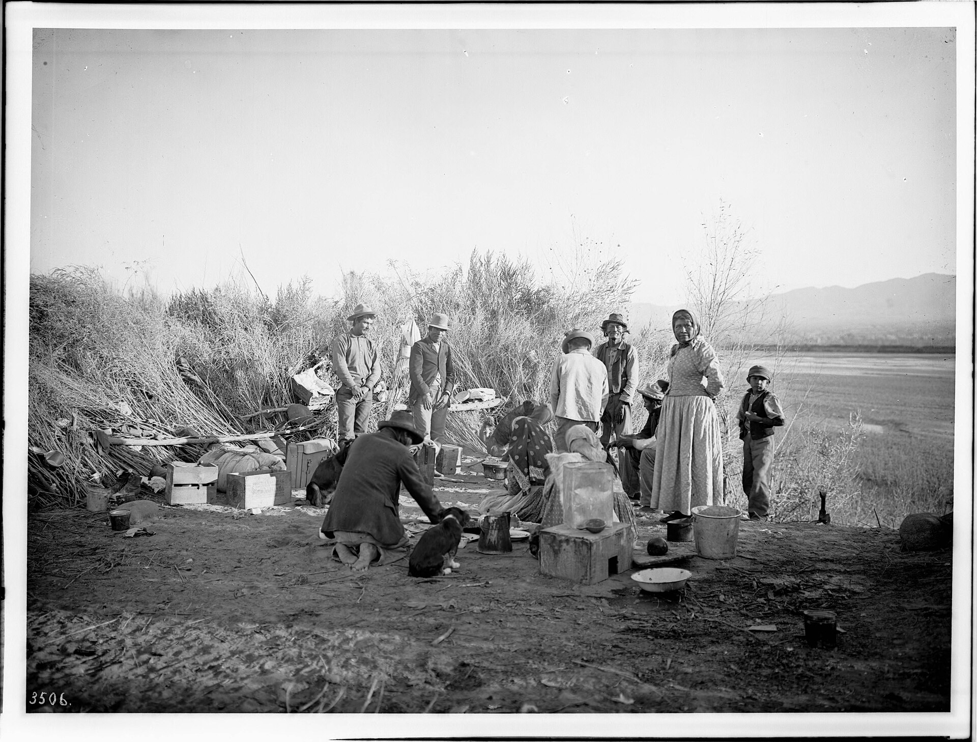 A group of Chemehuevi people at their desert camp in the lower Colorado River country, photographed around 1900.