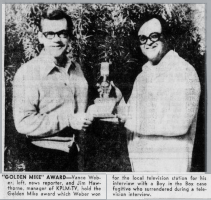 Newspaper photo of two men in glasses, reporter Vance Weber at left and KPLM-TV manager Jim Hawthorne at right, holding the small Golden Mike statuette between them.